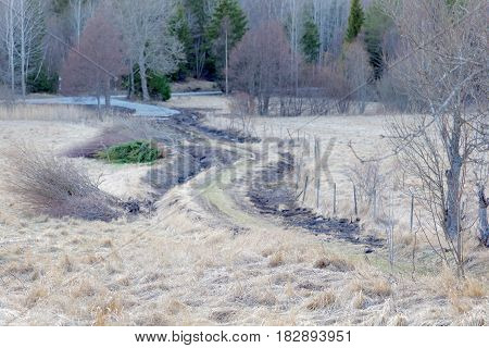 Rural country road surrounded by farming lands