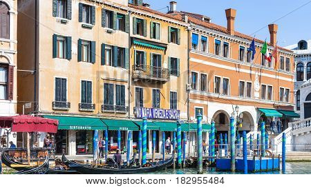 Gondolas Near Rialto Bridge On Grand Canal