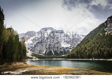 Spring view at Lago Braies, Pragser See Dolomites, Lake mountain landcape with Alps peak reflection , Italy
