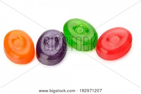 Four colorful fruit hard sugar candies,  boiled sweeties or sugar plums isolated on white background cutout