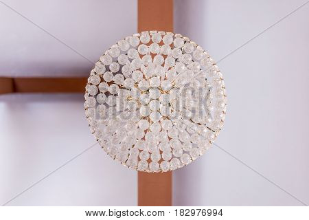 A clear symmetry ceiling lamp with T-junction woods