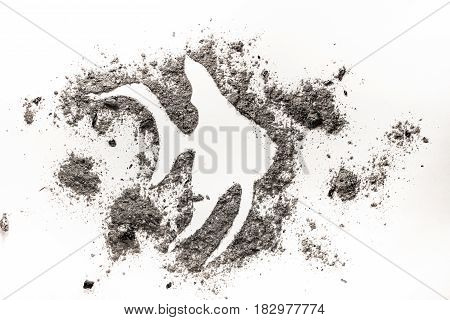 Exotic tropical fish silhouette symbol drawing made in grey ash or sand as marine or sea or ocean life sign extinction fossil sea endanger animal concept background
