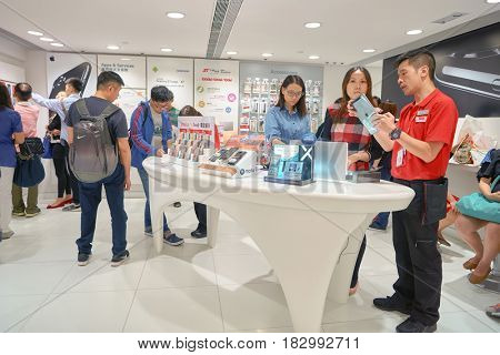 HONG KONG - CIRCA NOVEMBER, 2016: people at SmarTone shop. SmarTone Telecommunications Holdings Limited is a wireless communications carrier with operating subsidiaries in Hong Kong and Macau.