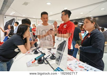 HONG KONG - CIRCA NOVEMBER, 2016: people at SmarTone shop. SmarTone Telecommunications Holdings Limited is a wireless communications carrier with operating subsidiaries in Hong Kong and Macau.