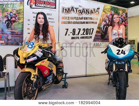 St. Petersburg Russia - 15 April, Young girls on motobikes,15 April, 2017.
International Motor Show IMIS-2017 in Expoforurum.
Models on motorcycles presented at the motor show.