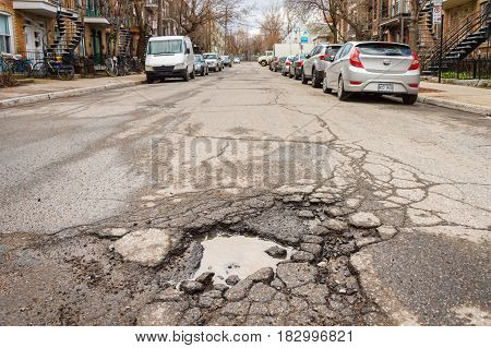 Montreal, Canada - 21 April 2017: Large Unrepaired Pothole On Cartier Street