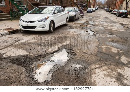 Montreal, Canada - 21 April 2017: Large Unrepaired Potholes On Chabot Street