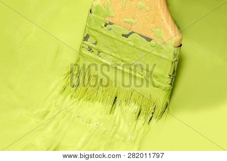 Closeup Flat Brush With Green Paints The Wall At Home