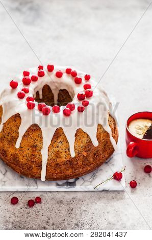 Lemon Poppy Seed Bundt Cake With Sugar Glaze And Redcurrant, Copy Space For Your Text