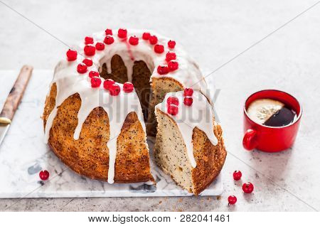 Sliced Lemon Poppy Seed Bundt Cake With Sugar Glaze And Redcurrant