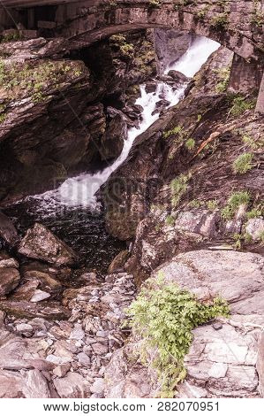 River Waterfall In Green Summer Mountains, Norway.