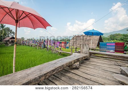 Nan,thailand - October 8, 2018 : The Local Woven Fabrics Are Dried On Wooden Bridges At Ban Tai Lue 