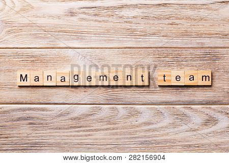 Managament Team Word Written On Wood Block. Managament Team Text On Wooden Table For Your Desing, Co