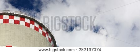 White Smoke Comes From Pipes Against Blue Sky. Problem Harmful Emissions And Air Pollution Of Centra