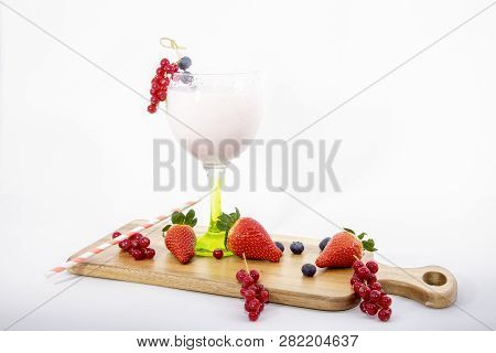 Strawberry Milkshake In A Glass Of Balloon With Fruits