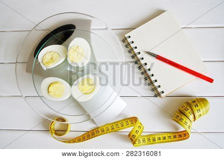 Counting And Recording The Amount Of Protein, Calories, Carbohydrates And Fats In Food. Chicken Egg 