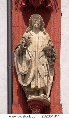 WURZBURG, GERMANY - JULY O4, 2018: Christ the Saviour statue on the portal of the Marienkapelle in Wurzburg, Bavaria, Germany
