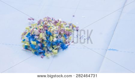 Global Ocean Pollution. Microplastic In Water And Food