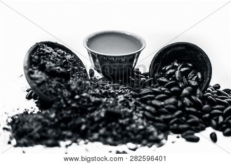 Close Up Of Paste Of Custard Apple Seeds In A Glass Bowl With Some Powdered Seeds And Raw Dried Seed