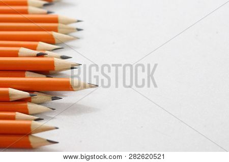 Simple Pencils For Office Workers. Pencils For Drawing. Pencils Are Scattered On A White Table And S