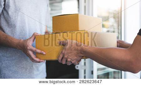 Delivery Mail Man Giving Parcel Box To Recipient, Young Owner Accepting Of Cardboard Boxes Package F