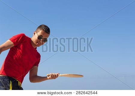 The Guy Plays Matkot On The Beach