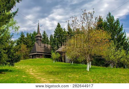 Scenic Spring Rural Landscape With Traditional Maramures Wooden Neo-gothic Church, Maramures, Romani