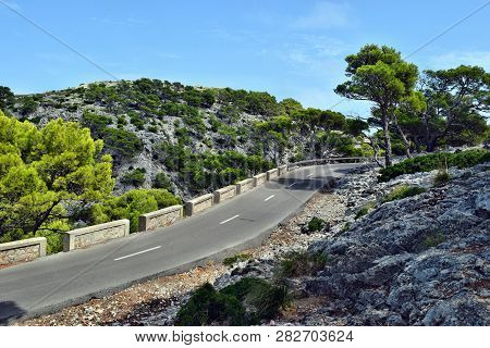 Open Coastal Road Winding Through To Lighthouse Cap Formentor