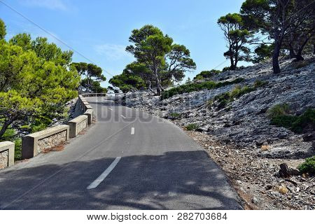 Open Coastal Road Winding Through To Lighthouse Cap Formentor