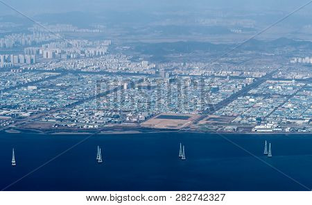 Cityscape And River Seen From Commercial Aircraft