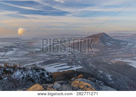 Sunrise On Boren Hill Near Bilina Town In Winter Frosty Color Morning