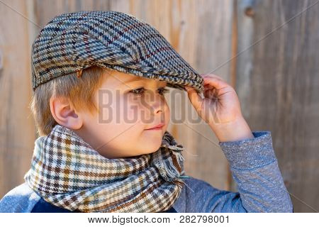Children Fashion Model. Cute Child. Boy In The Cap. Vintage Kid Concept. Elegant Young Man.