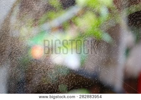 Blurred Many Small Spraying Droplets In The Air In Outdoor Space For Background Backdrop