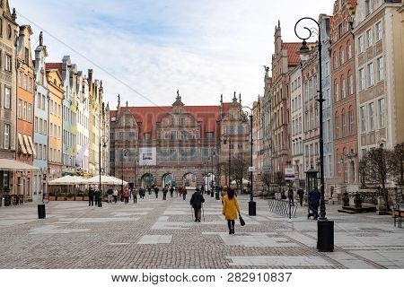 Gdansk, Pomeranian / Poland - February, 07, 2019: Walking People On The Market Near Neptune. Market
