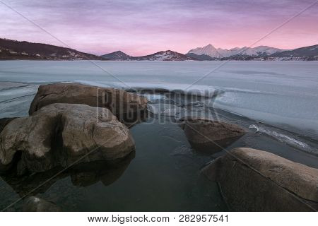 Magic View Of Gran Sasso E Monti Della Laga National Park. Campotosto Lake At Sunset