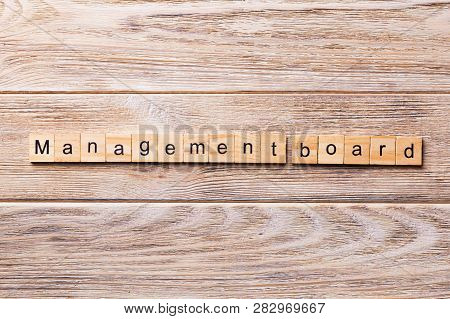 Managenment Board Word Written On Wood Block. Managenment Board Text On Wooden Table For Your Desing