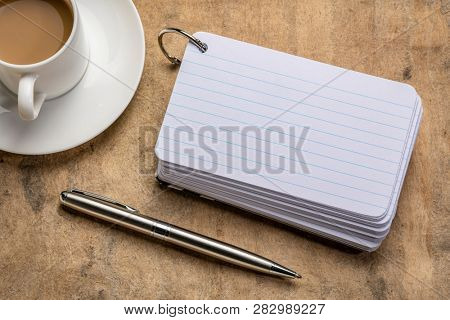 blank index cards with a cup of coffee and   apen