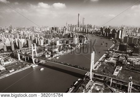 Shanghai Nanpu Bridge over Huangpu River with busy traffic in China.