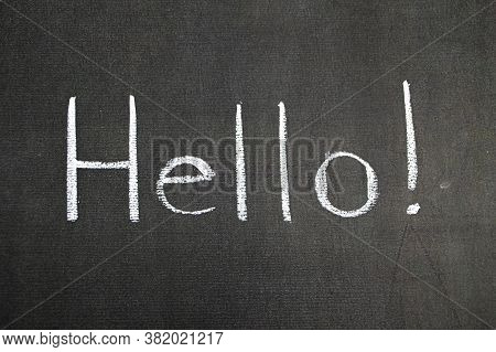 Greeting Chalk Hello White Text On Black Background. Word Welcome Horizontal Concept Hi Message Sign