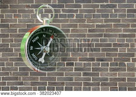 Abstract Photo With Compass On Brick Wall Background As Symbol Of Tourism With Compass, Travel With 