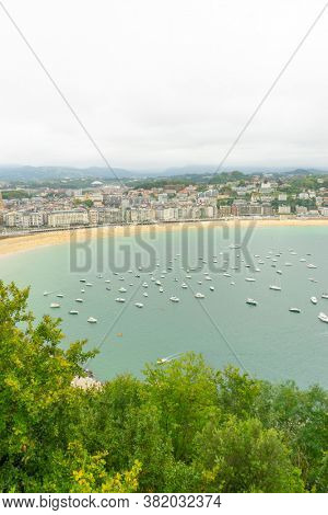 Holiday, view of the city of San Sebastian, with La Concha beach, from Mount Urgull. Summer vacation scene in Spain