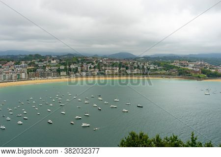 Coastline, view of the city of San Sebastian, with La Concha beach, from Mount Urgull. Summer vacation scene in Spain