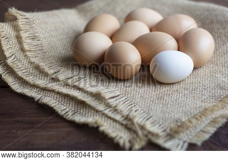 Fresh Yellow And White Country Eggs On A Wooden Table.