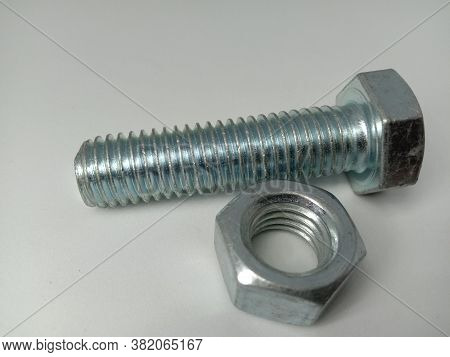 Iron Nuts And Bolt Closeup On White Background