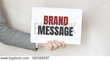 Businessman Holding A Card With Text Brand Message