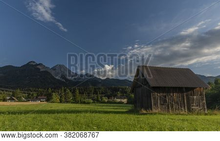 Color Evening With Cloudy Blue Sky In Ledenitzen Village In South Austria