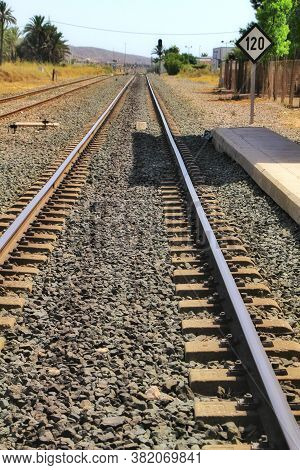 Speed Sign Limited To 120 Km Per Hour Next To Train Tracks In Spain