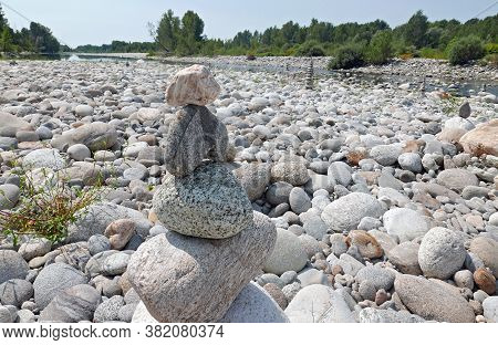 River Stones Pile Along Sesia River Piedmont, Italy