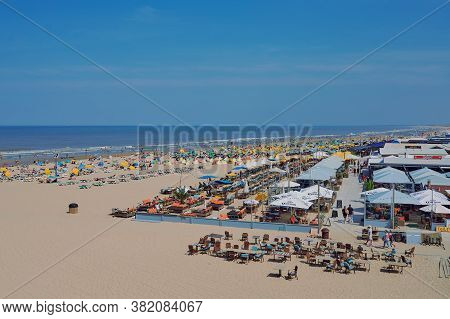 Scheveningen, Netherlands - August 10, 2020: People At The Famous Beach In Scheveningen, Netherlands