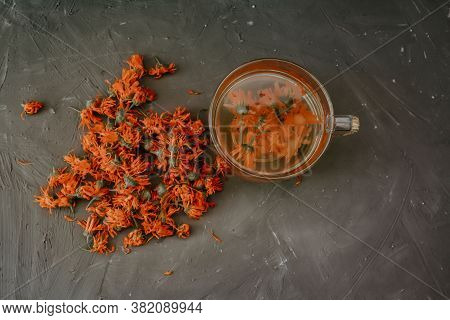 Flower Light Tea In A Transparent Large Cup, Orange Calendula.